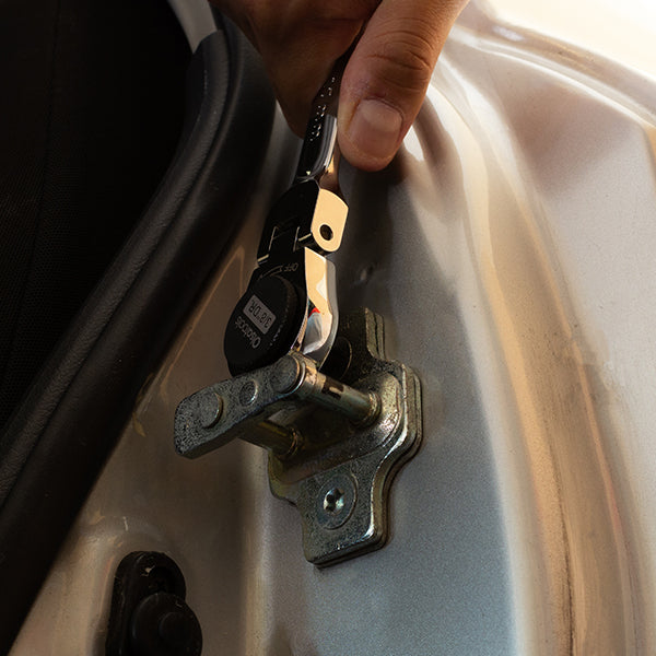 Mechanic using a stubby impact socket with a stubby impact socket retaining clip